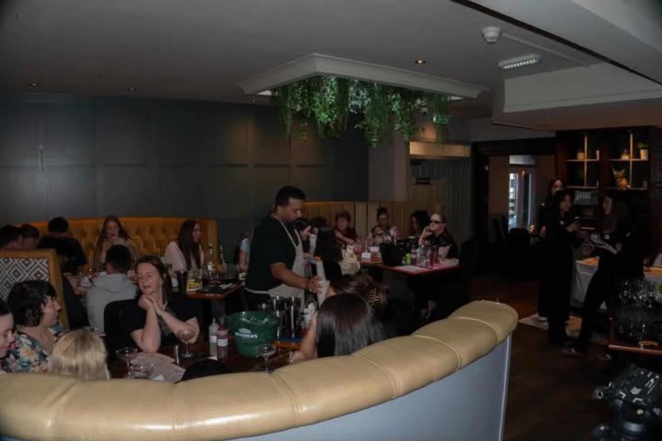 Busy room of guests at the charity cocktail evening